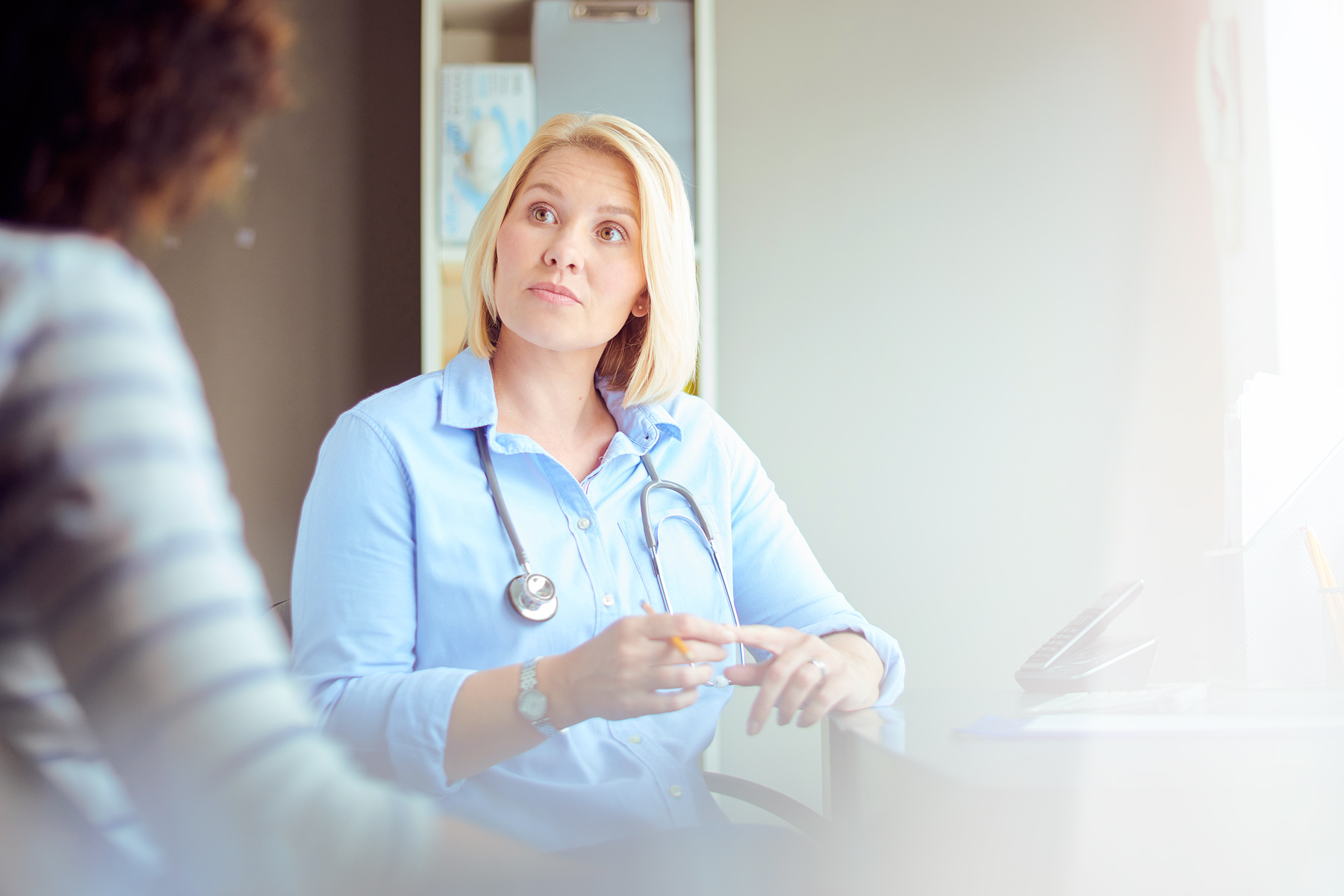 Doctor consulting with patient
